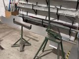 a room that has a lot of shelves and tools in it