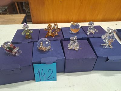 a lot of glass figurines that are on the table