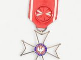 a red and blue medal with a star on it