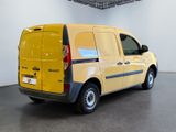 a yellow van that is parked in a room