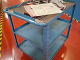 a blue cart with a piece of paper on top of it