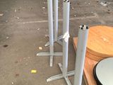 four metal poles that are sitting on a pallet