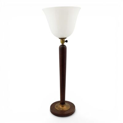 a lamp with a wooden base and a white glass shade