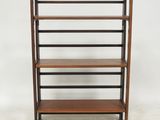 a wooden shelf with three shelves on top of it