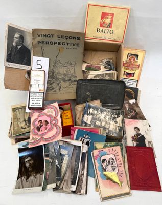 a pile of old books and other items on the table