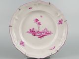 a pink and white plate with pink flowers on it