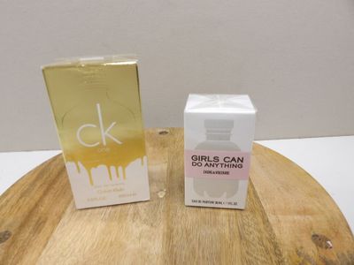 a bottle of perfume and a box of perfume on a table