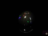 a computer mouse sitting on top of a black surface