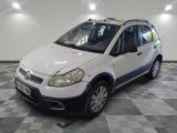 a picture of a small white car parked in a garage