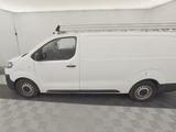 a picture of a white van parked in a garage