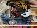 a basket full of assorted hats and other items