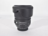 a close up of a camera lens on a white surface