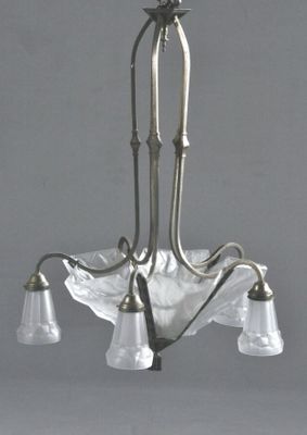 a chandelier with five glass shades hanging from the ceiling