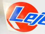 a close up of a pepsi sign on a table