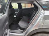 a car that has the door open and the seats down