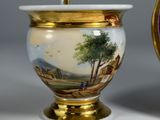 two vases that have been painted with a landscape on them