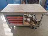 a workbench with many drawers on it in a garage