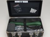 a black suitcase with a black handle and a green handle
