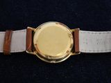 an image of a close up of a watch with a leather band