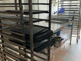 many racks of food that are on the floor in the kitchen