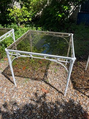 a glass table with a metal frame on it