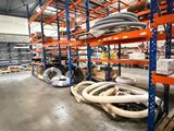 many pipes and hoses on the shelves in the warehouse