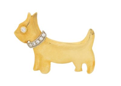 an image of a yellow dog brooch with a diamond collar