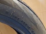 a close up of a tire on a wooden surface