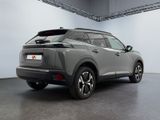 the rear view of a grey suv parked in a garage