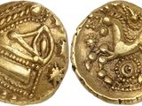 une pièce d'or sur laquelle est représenté un oiseau