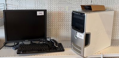 a desktop computer sitting on a shelf next to a monitor and keyboard