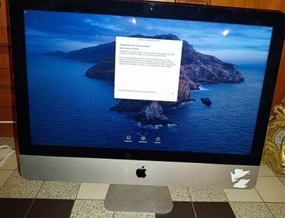 a computer monitor sitting on top of a desk