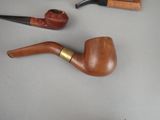 a lot of different types of pipes on the table