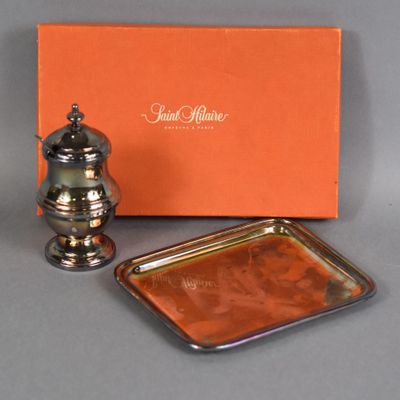 an orange box with a silver tray and a silver pepper shaker