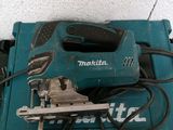 a small blue tool that is sitting on top of a table