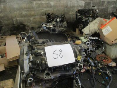a lot of junk on the floor of a garage