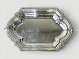 a silver tray with a decorative design on it