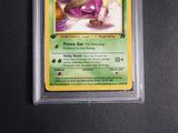 a close up of a pokemon card on a black surface