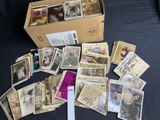 a box full of old postcards on a table