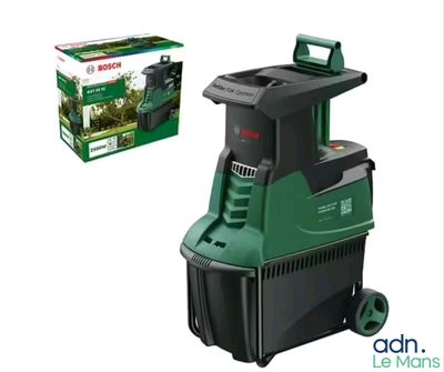 the bosch vacuum cleaner is next to a box of grass