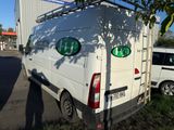 a white van that is parked on the side of the road
