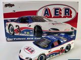 a close up of a toy car in front of a box