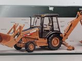 a box with a picture of a backhoe and a backhoe