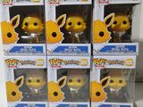 three boxes of pokemon pikachu pop vinyl figures on a table