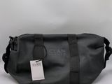 a close up of a black bag with a tag on it