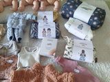 many baby dolls sitting on the floor next to each other