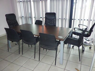 a table and chairs in a room with a sliding glass door