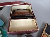 a small open box that has a bunch of books in it