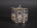 a close up of a silver box on a black surface