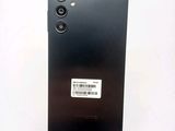 a close up of the back of a black phone with a barcode on it